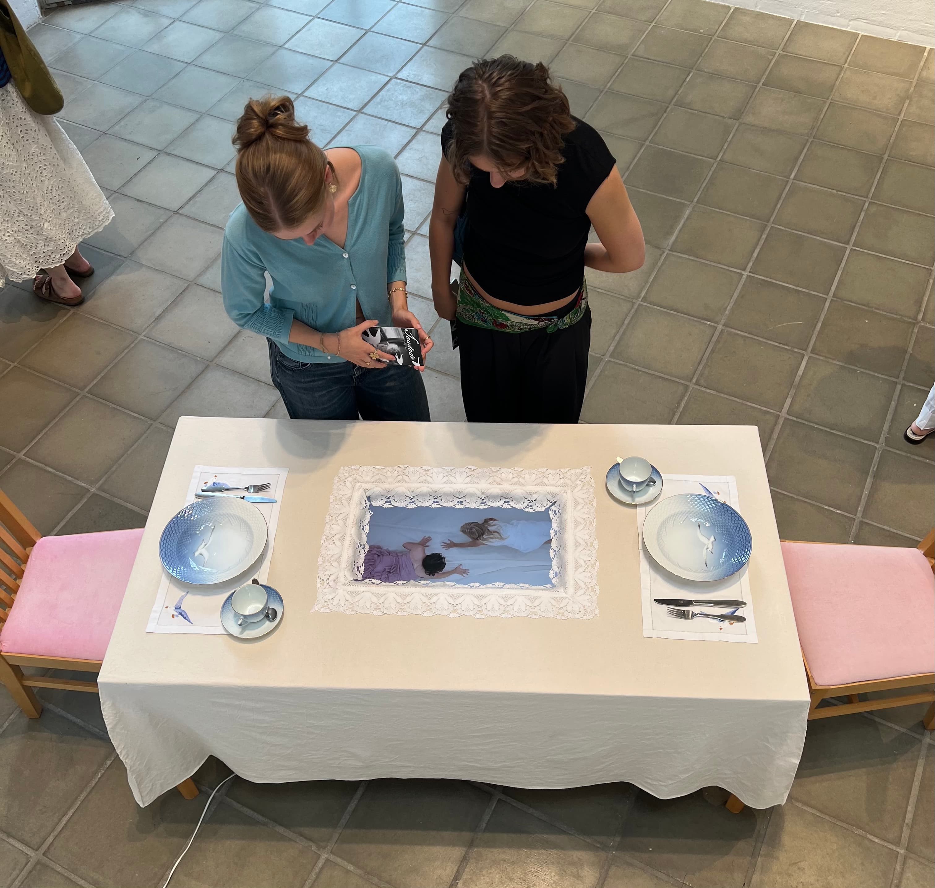 girls looking at table.jpg
